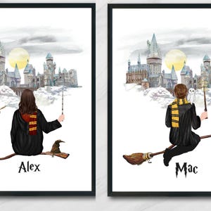 May include: Two framed wall art prints featuring watercolor illustrations of figures on broomsticks against a castle backdrop. One print shows a figure labeled Alex with a golden snitch, the other shows a figure labeled Mac with a white owl.