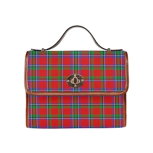 May include: A red, green and blue plaid handbag with a brown leather trim and a gold-toned clasp.