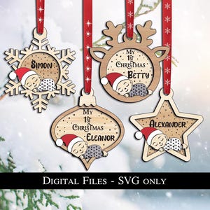 May include: Wooden Christmas ornaments in snowflake, reindeer, teardrop, and star shapes. Each ornament features a baby in a Santa hat and the text "My 1st Christmas" and a name. Red ribbon hangers.