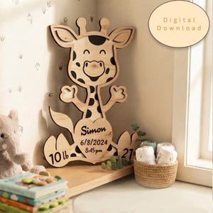 May include: A laser-cut wooden giraffe wall plaque featuring a heart-shaped belly with the name Simon, birth date 6/8/2024, time 8:45 pm, weight 4.54 kg, and length 68.58 cm. The giraffe has dark brown spots and a light wood finish.
