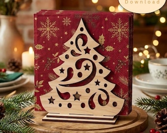 May include: A light-colored wooden napkin holder featuring a laser-cut Christmas tree design with star and swirl cutouts, holding a stack of deep red paper napkins printed with gold snowflakes and holly leaves, labeled Digital Download.