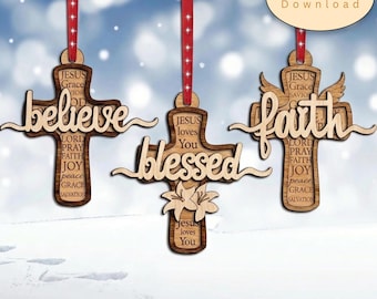 May include: Three wooden cross ornaments hanging from red ribbons. The crosses feature laser-cut words believe, blessed, and faith, along with engraved religious text and floral accents. A digital download label is visible in the corner.