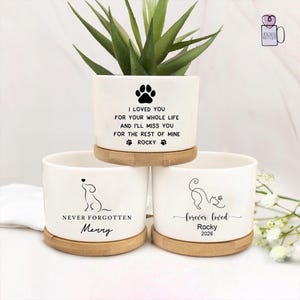 May include: A white ceramic mug with a black handle and the text "But First, Coffee" in a black, bold font. The mug is on a white surface. The mug is approximately 4 inches tall.