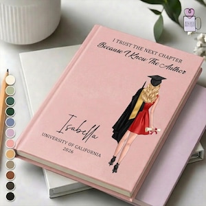 May include: A pink hardcover journal with the text "I TRUST THE NEXT CHAPTER Because I Know The Author" and the name "Isabella" printed on the cover. A graduation illustration is featured. The journal also includes "UNIVERSITY OF CALIFORNIA 2026".
