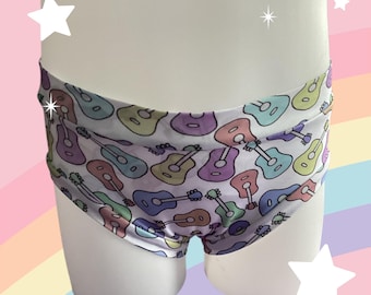 BRAGUITAS INFANTILES AMAB, No binario, por dentro, blancas con guitarras de diferentes colores