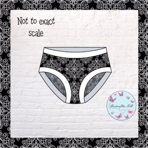 May include: Black and white underwear with a white lace pattern. The text "Not to exact scale" is written on the image.
