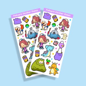 Op de afbeelding: Twee sticker vellen met diverse cartoonfiguren en objecten. De stickers bevatten een meisje met roze haar, een paarse blob, een blauw wezen en een gele draak. De tekst "Pokopia Sticker Sheet" staat bovenaan elke vel.