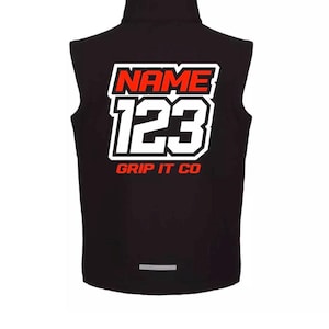 May include: Black sleeveless vest with a high collar. The back displays the text "NAME" in red, outlined in white, above the number "123" in white with a black outline. Below is "GRIP IT CO" in red. A reflective strip is at the bottom.