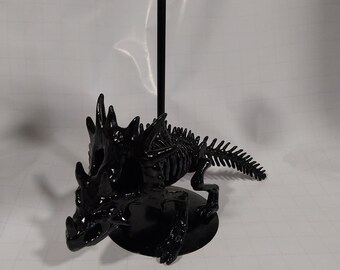 Dinosaur candle holder.