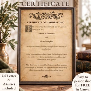 May include: A framed certificate of handfasting on aged parchment paper with dark brown text and decorative flourishes. The document includes the names Rowan Willowhart and Elias Greenfield, dated 31 October 2025, with lines for witness and officiant signatures.