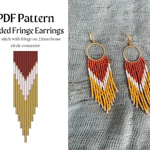 May include: A pair of beaded fringe earrings with a gold-colored hoop and a brick stitch design. The earrings feature a pattern of red, white, and yellow beads. The image also includes a PDF pattern for the earrings.