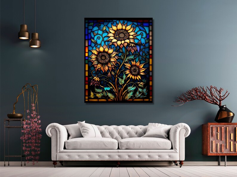 May include: A stained glass window design featuring three sunflowers with yellow petals and brown centers. The sunflowers are surrounded by green leaves and vines. The background is a blue and green mosaic pattern.