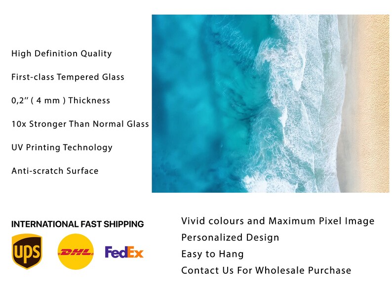 May include: A close-up of a glass print featuring an aerial view of a beach with turquoise water and white waves crashing on the shore. The print is 0.2 inches thick and made of tempered glass. It is 10 times stronger than normal glass and features UV printing technology for vibrant colors and a scratch-resistant surface.