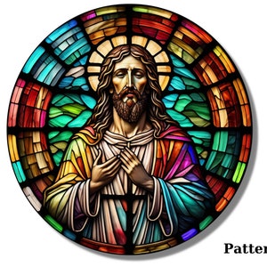 May include: A stained glass window depicting Jesus Christ with a colorful background. The image is circular and features a halo around Jesus' head. The colors in the stained glass are vibrant and include red, blue, green, yellow, and purple.
