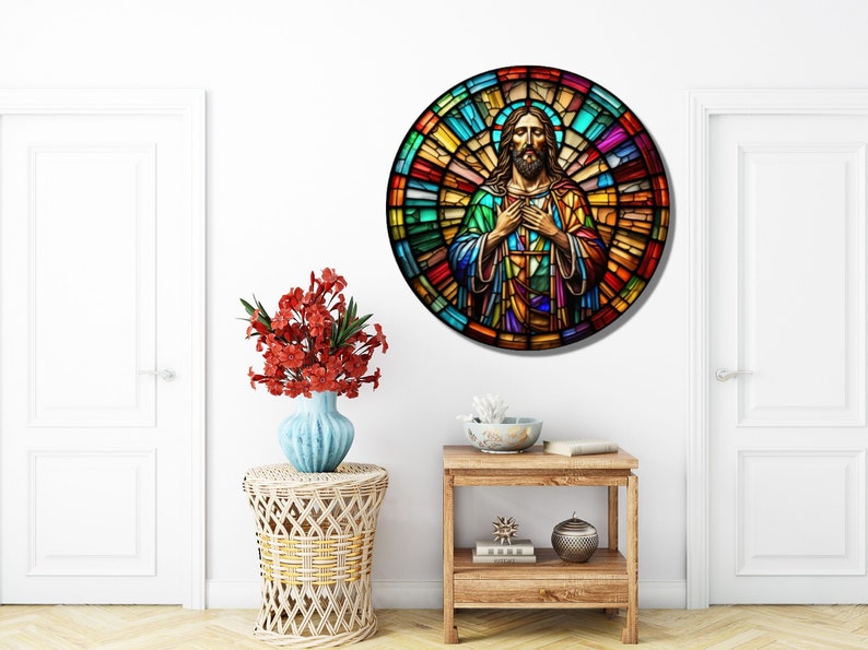 May include: A round stained glass window depicting Jesus Christ with a colorful background. The stained glass is in shades of red, orange, yellow, green, blue, and purple.