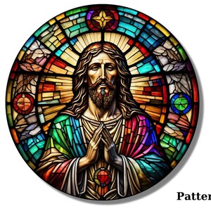 May include: A stained glass window depicting Jesus Christ with a colorful background. The image is circular and features a halo around Jesus' head.