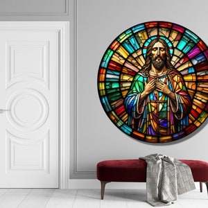 May include: A stained glass window depicting Jesus Christ with his hands clasped over his heart. The window is circular and features a colorful mosaic design.