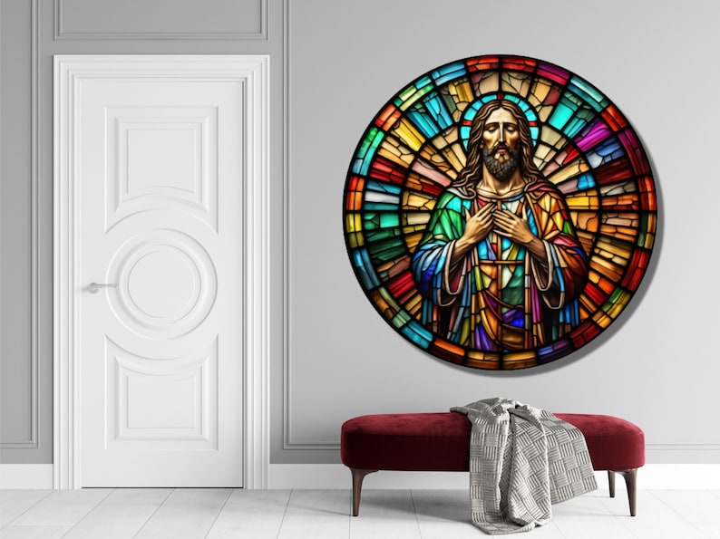 May include: A stained glass window depicting Jesus Christ with his hands clasped over his heart. The window is circular and features a colorful mosaic design.