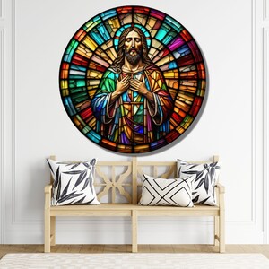 May include: A stained glass window depicting Jesus Christ with a colorful background. The image is circular and features a variety of colors, including red, blue, green, and yellow.