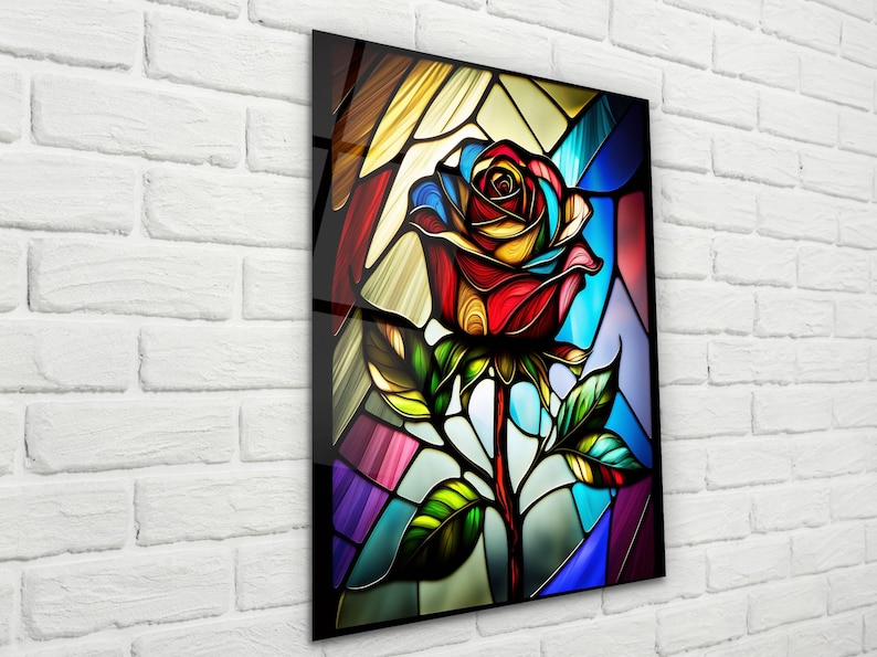 May include: A stained glass style image of a colorful rose with red, yellow, blue, and green hues. The rose is depicted in a traditional stained glass style with intricate details and a black outline.