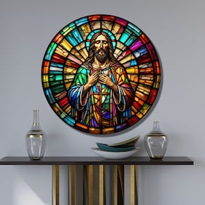 May include: A round stained glass window depicting Jesus Christ with a colorful background. The stained glass is in shades of red, orange, yellow, green, blue, purple, and white.