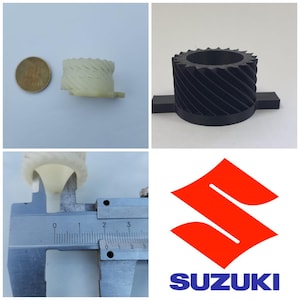 May include: Two white plastic gears, one with a black gear, and a Suzuki logo. The white gears are 2.5 cm in diameter.