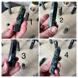 May include: Four green and black serpentine stone points, each with a unique pattern. The points are displayed on a wooden surface. The image is divided into four sections, each with a number from 1 to 4.