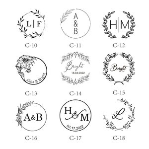 May include: A set of 18 different black and white stamp designs featuring various floral wreaths, initials, and dates. The designs are arranged in a grid pattern on a white background.