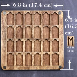 May include: A wooden tag holder with 25 slots, measuring 6.8 inches by 6.5 inches. The holder is made of brown wood and has a natural finish.