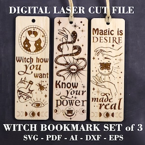 May include: Set of three wooden bookmarks with laser-cut designs. The bookmarks feature a witchy theme with illustrations of a snake, a hand, a butterfly, a moon, and a sun. The text on the bookmarks reads "Witch how you want", "Know your power", and "Magic is desire made real".