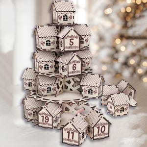 May include: A wooden advent calendar shaped like a Christmas tree. The tree is made of small, numbered houses with decorative details. Each house has a window and a decorative roof. The numbers are in a dark brown color.