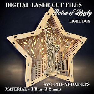 May include: Laser cut file design for a light box featuring the Statue of Liberty and fireworks. The design is in the shape of a star and is made for 1/8 inch (3.2 mm) material. The file formats included are SVG, PDF, AI, DXF, and EPS.