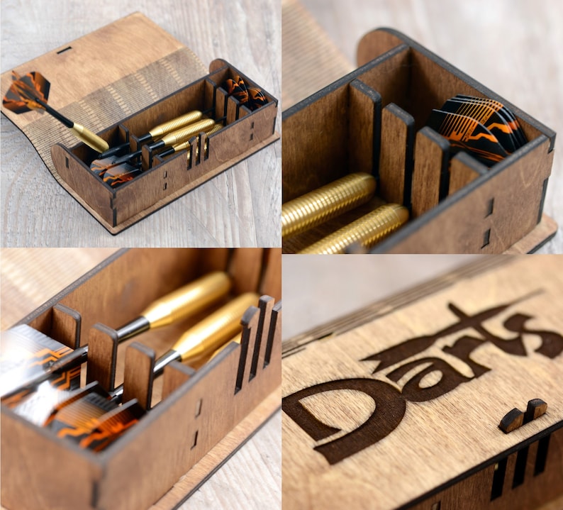 May include: A wooden box with a hinged lid for storing darts. The box has a compartment for the darts and a separate compartment for the dart flights. The box is engraved with the word "Darts".