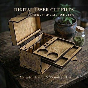 May include: A wooden box with a sliding tray and multiple compartments, designed for digital laser cutting. The box is made of light brown wood and features the text "DIGITAL LASER CUT FILES" and file type abbreviations. Material thickness is 1/4 inch.