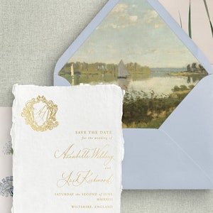 May include: Save the date card with a gold monogram and the text "Save the Date for the wedding of Annabelle Wilding and Jack Kirkwood Saturday the Second of June MMXXIII Wiltshire, England Formal invitation to follow"