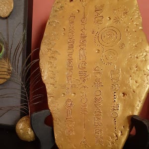 Decorative clay plaque with symbol