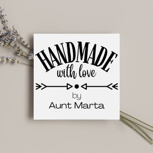 May include: Black and white graphic design with the text "HANDMADE with love by Aunt Marta" on a white background.