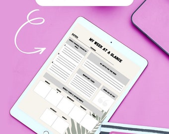 May include: A digital planner on a tablet with a weekly layout. The planner includes sections for dates, weekly progress towards goals, important tasks, and a daily motto. The tablet is on a pink surface with a green plant in a pot.