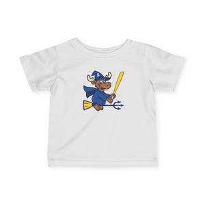 May include: White short-sleeved t-shirt featuring a cartoon moose dressed as a wizard, riding a broom and holding a yellow bat. The moose wears a blue wizard hat and cape. The design is in blue, yellow, and brown.