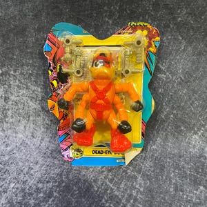 Bucky O’Hare action figure: Dead Eye Duck, 100% complete. Still in original bubble card. Mint condition. Hasbro 1990
