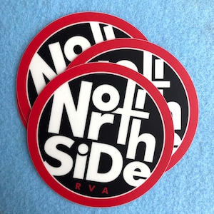 May include: Three red and black round stickers with the text "North Side RVA" in white letters.