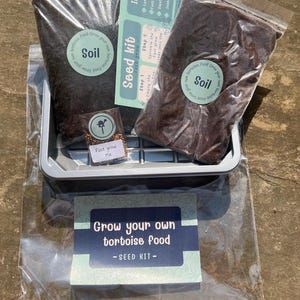 May include: A tortoise food seed kit with a small plastic tray, a bag of soil, a bag of seeds, and instructions. The kit includes everything you need to grow your own tortoise food.