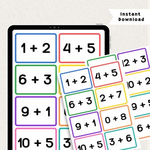 May include: A digital tablet and a printed sheet displaying math flashcards with addition problems. Each card features a white background, a colored border, and black text showing equations like 1+2, 4+5, 6+3, 9+1, 10+5, 2+7, 0+8, 3+6, 12+3, 10+2, and 9+5. The text Instant Download is visible.