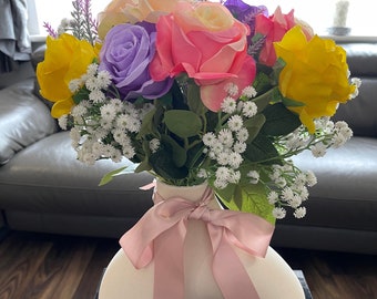 Bouquet of artificial flowers with silk roses & babies breath.Hand  arranged in a irregular shaped ceramic vase.Mothers day