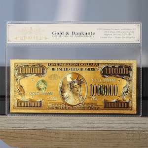 May include: A gold-plated $1,000,000 bill with a picture of the Statue of Liberty. The bill is encased in a clear plastic sleeve with a certificate of authenticity. The text on the bill reads "One Million Dollars" and "The United States of America".