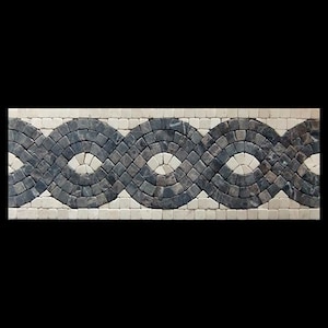 May include: A black and white mosaic tile border with a wavy pattern. The border is made of small, irregular shaped tiles.
