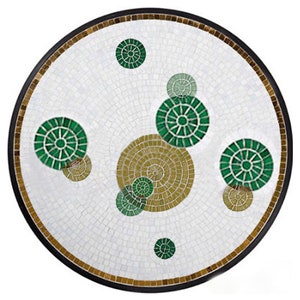 May include: A round table top with a white mosaic background and a design of green and gold circles.