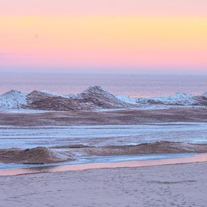 May include: A set of three ceramic mugs with a speckled, matte finish. The mugs are in shades of cream, light gray, and dark gray. Each mug has a simple, modern design and a rounded handle.