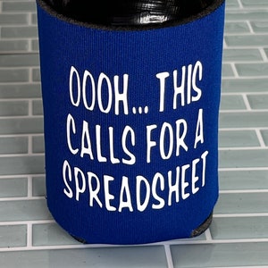 May include: Blue can cooler with the text "OOH... THIS CALLS FOR A SPREADSHEET" in white.