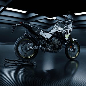 May include: A black and white Yamaha motorcycle with gold accents. The motorcycle has a unique paint scheme and is parked on a stand. The word "YAMAHA" is visible on the side.